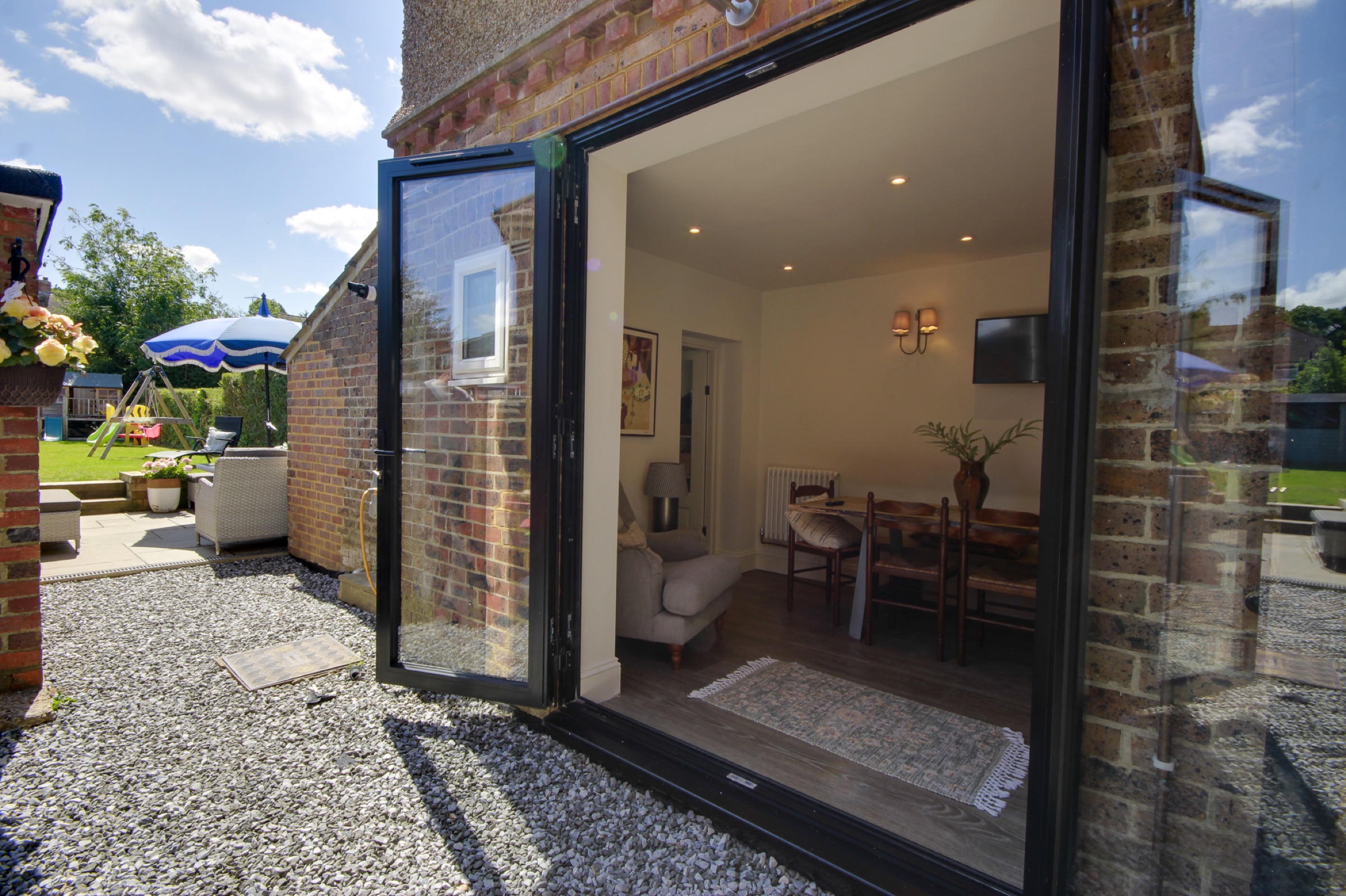 Loft Conversion, Haywards Heath — bifold doors to garden
