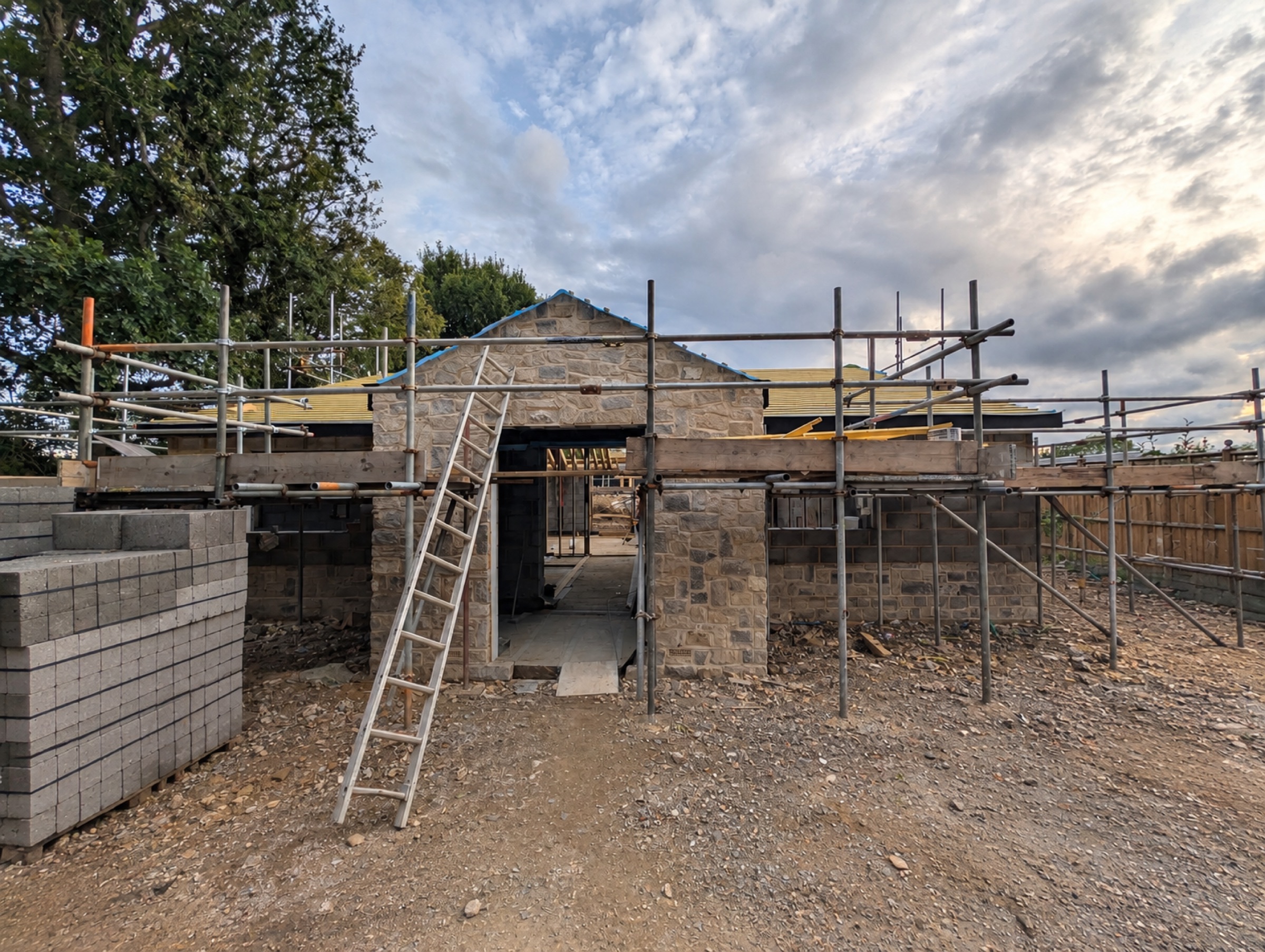 New Build, Warninglid — stone-clad shell under construction
